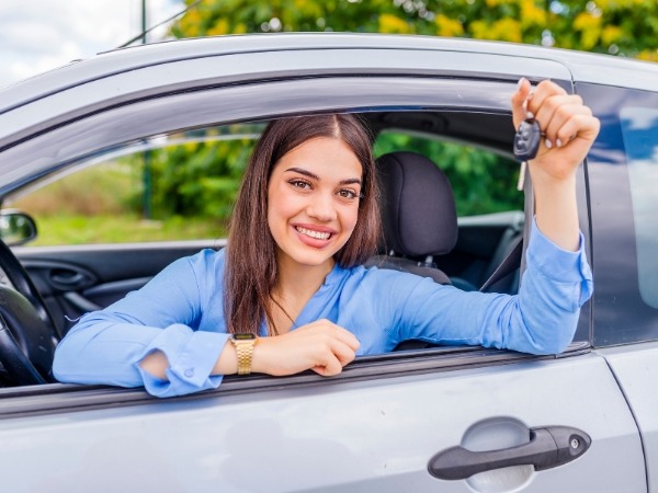 Woman Inside a Car Holding Keys