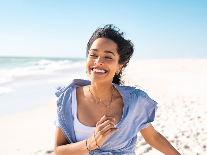Happy Woman on a Beach
