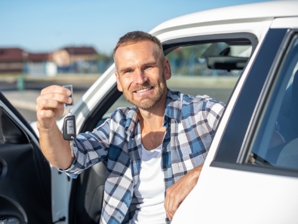 Man Holding a Car Key