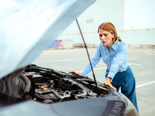 Woman with Broken Down car