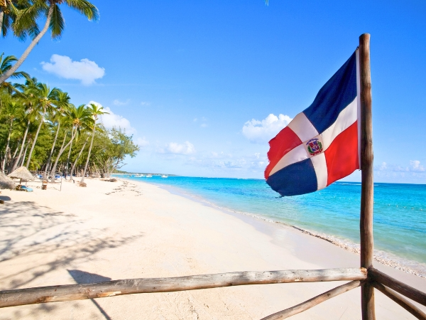 Punta Cana Beach with Dominican Republic Flag
