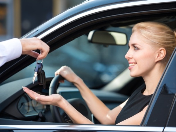 Woman Receiving Car Keys