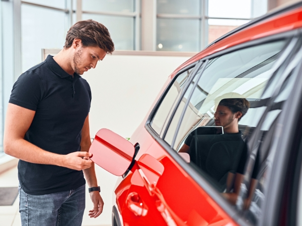 Man Inspecting a Car