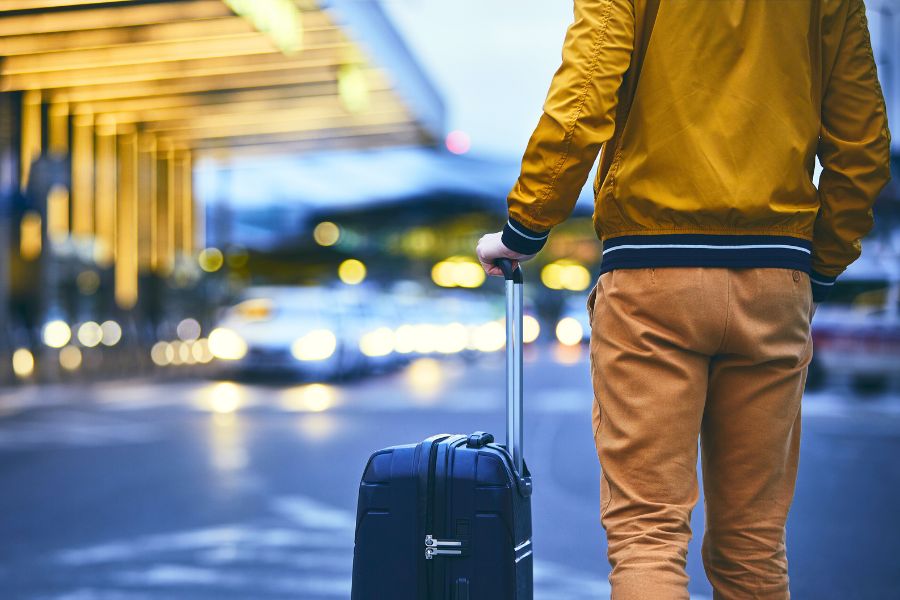 A happy man driving his rental car