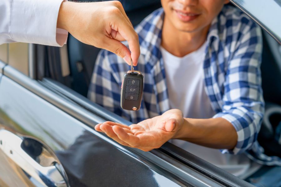 Woman with Rental Car at Airport Parking Lot